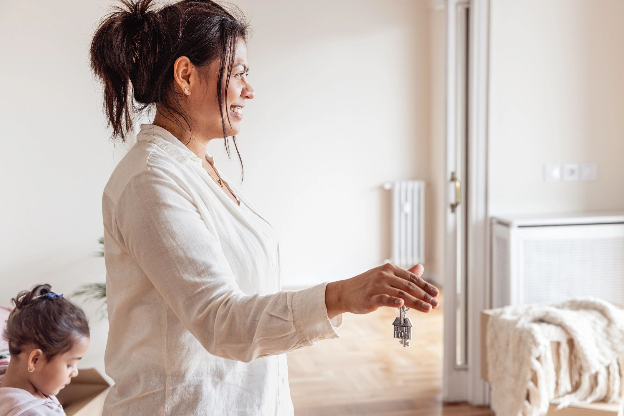 Homeowner holding keys after a successful transition