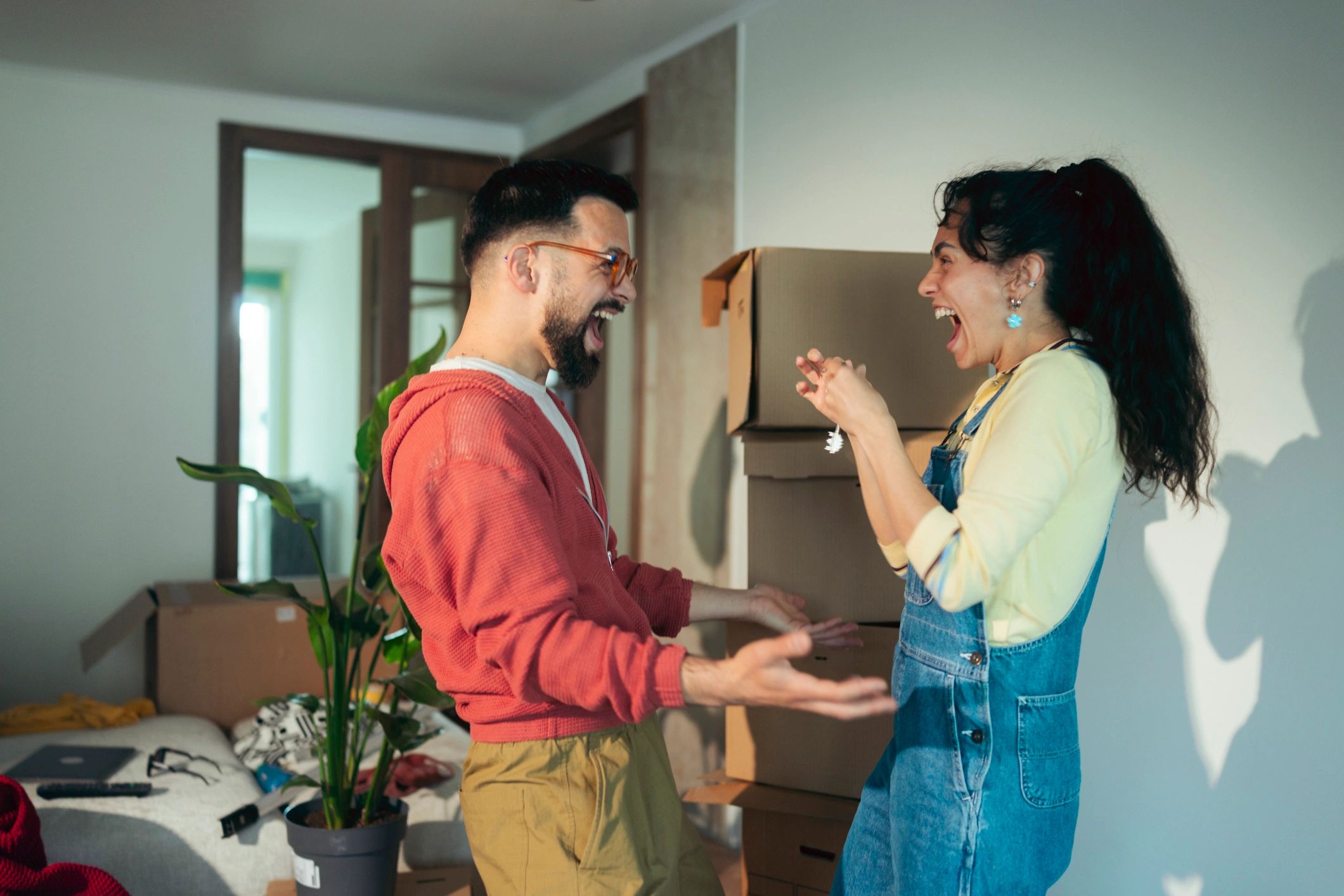 Happy couple celebrating a successful home sale